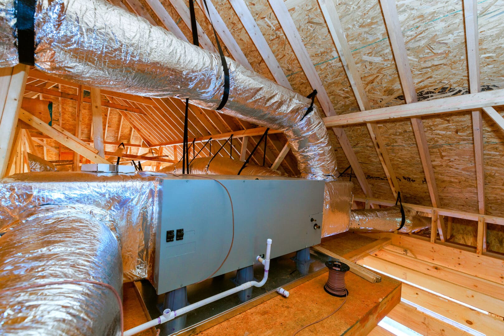 Insulated HVAC ducts and air handler in attic